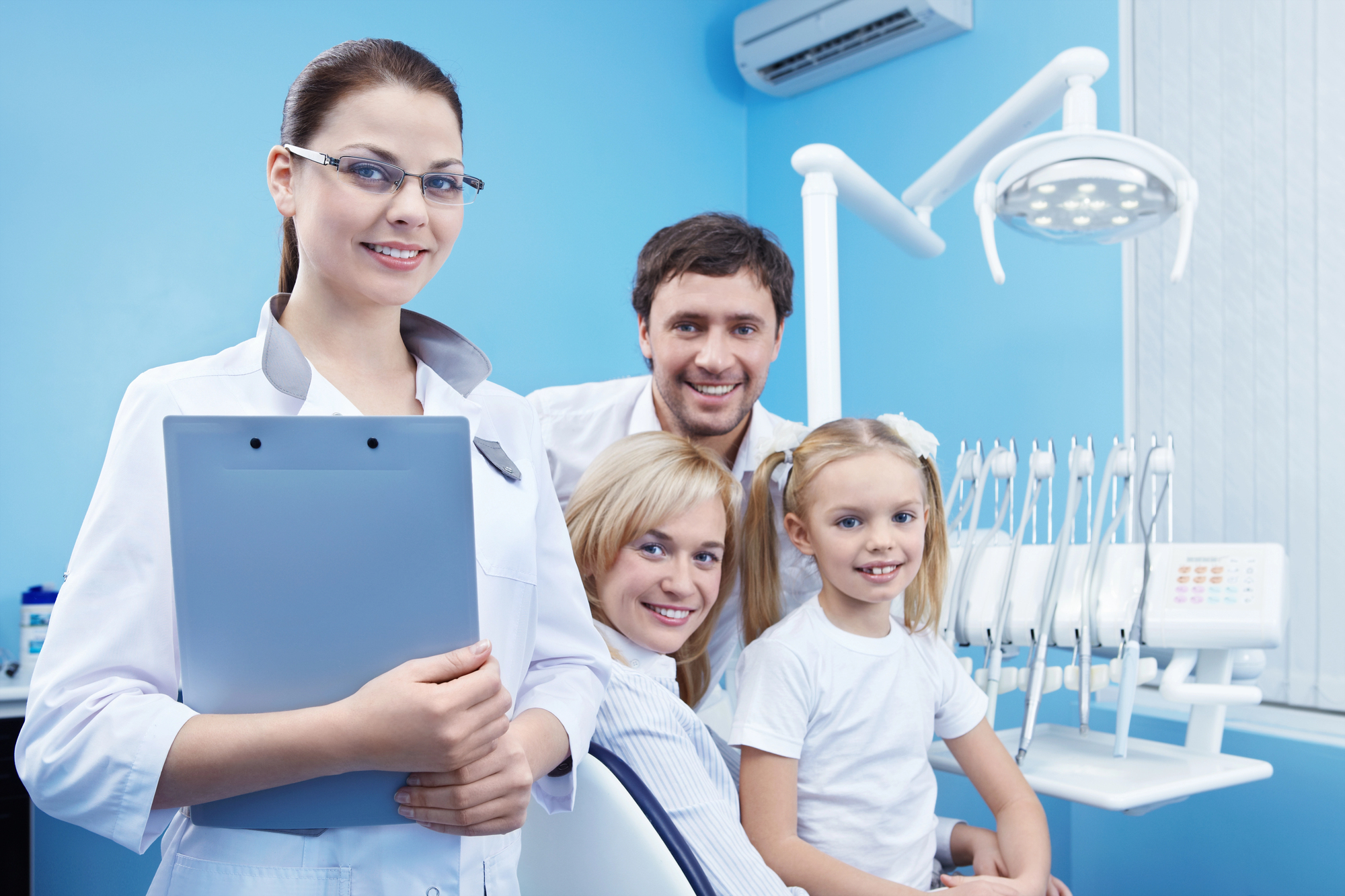 Smile Scarsdale Family Dental promoting dental care services with a happy family smiling together
